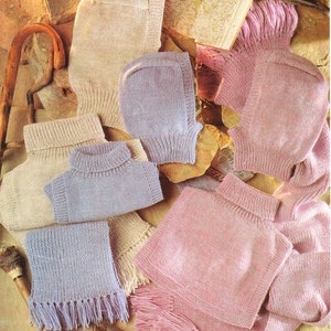May include: A set of knitted scarves and hats in various colors, including pink, purple, and beige. The scarves have fringe detailing and the hats have a slouchy design.