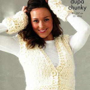 May include: A white knitted vest with a button closure. The vest is made with a chunky yarn and has a v-neck. The model is wearing the vest with a white t-shirt underneath.