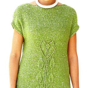 May include: A green knit top with a leafy design and a scoop neck. The top has short sleeves and a loose fit.