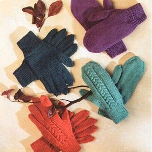 May include: Five pairs of knitted mittens in various colors, including purple, teal, and orange. The mittens are arranged on a light brown surface with a few dried leaves.