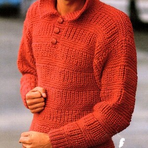 May include: A red knitted sweater with a button-up collar. The sweater is made with a chunky yarn and has a textured stitch pattern. The text "Chunky" is visible in the top right corner of the image.