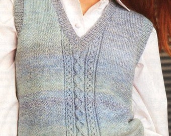 May include: A blue and green knitted vest with a cable knit pattern down the front. The vest has a v-neck and is sleeveless.