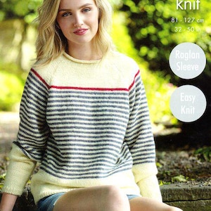 May include: A knitted sweater with horizontal blue and white stripes, a yellow yoke, and red trim. The sweater has long sleeves and is labeled "double knit" with measurements of 81-127 cm. The design includes a raglan sleeve and is easy to knit.