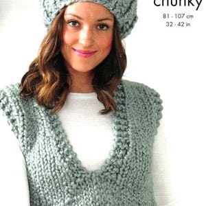May include: A light blue knitted vest with a V-neck and a matching light blue knitted beret. The text "supa dupa chunky" is printed on the image, along with the measurements "81 - 107 cm, 32 - 42 in".