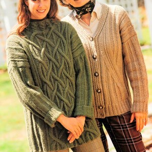 May include: Two women wearing knitted sweaters. One sweater is green with a cable knit pattern and the other is beige with a button-up front.