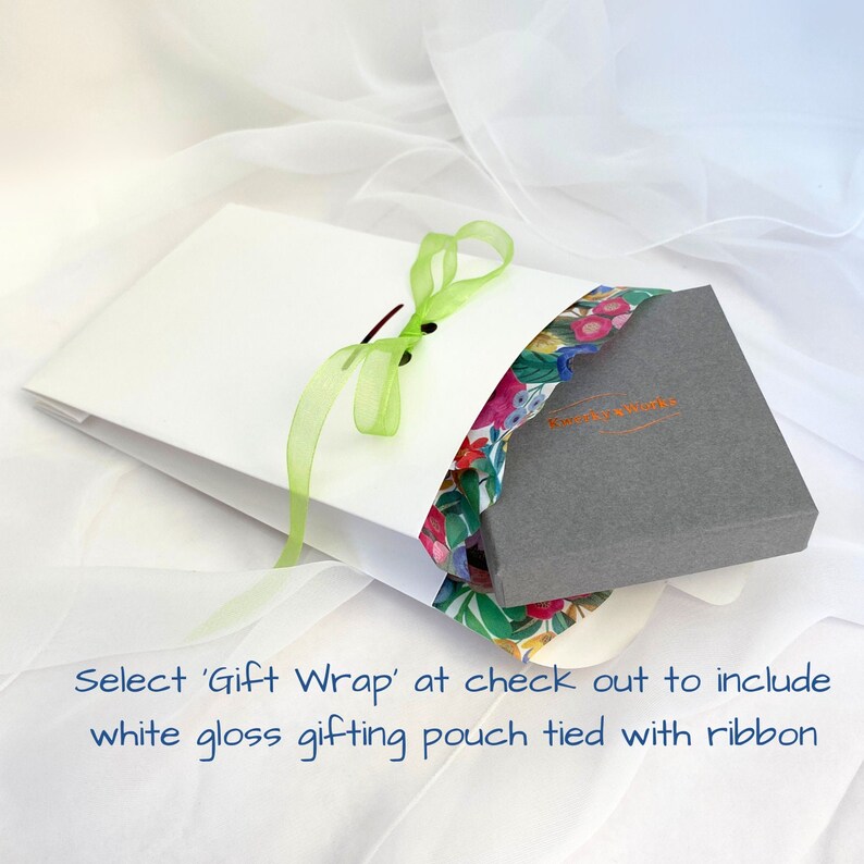 Select GIFT WRAP at checkout to include a pretty white glossy gifting pouch tied with ribbon. Additional cost applies. 
The gift box with bracelet is neatly lined with colourful tissue paper and placed inside the pouch.