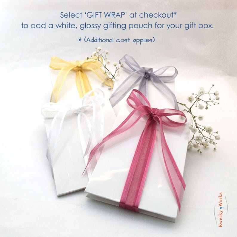 This picture shows the ribbon tied glossy white gift pouch that you can add to your order (additional cost applies), if you want the bracelet and gift box gift wrapped. To add this extra option, click 'gift wrap' at checkout. Charge applies to ONE gift pouch per order.