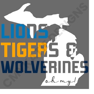 May include: A white outline of the state of Michigan with the words "Lions, Tigers & Wolverines" in blue, orange, and gray text. The text "oh my!" is written in cursive below the state outline.