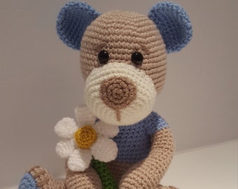 Dreamy beige and blue/pink/orange teddy bear with flower. Handmade crochet soft toy.