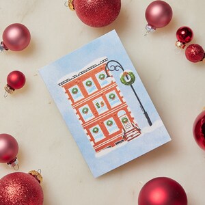 Biglietto d'auguri per la casa dolce casa, cancelleria per Natale in città, biglietto per appunti festivo bianco metropolitano