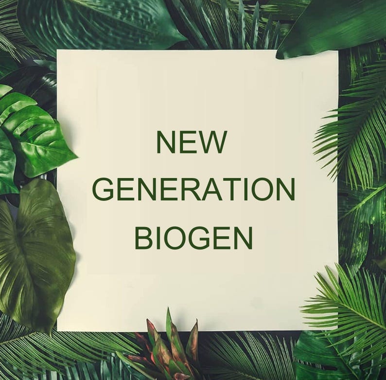 May include: A square, cream-coloured sign with the words "NEW GENERATION BIOGEN" in dark green, set against a backdrop of vibrant green tropical foliage. The leaves are diverse in size and form, creating a natural, lively setting.