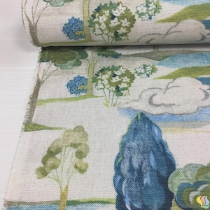 May include: A roll of fabric with a scenic landscape design. The fabric features a repeating pattern of trees, clouds, and water in shades of blue, green, and white. The fabric has a linen-like texture.