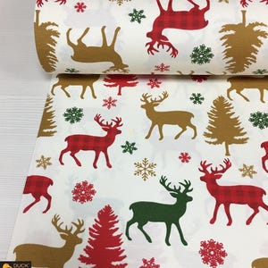 May include: White fabric roll with a repeating Christmas pattern. The design features reindeer in red plaid, brown, and green, along with snowflakes and Christmas trees in red and brown. Ideal for holiday crafts and decor.