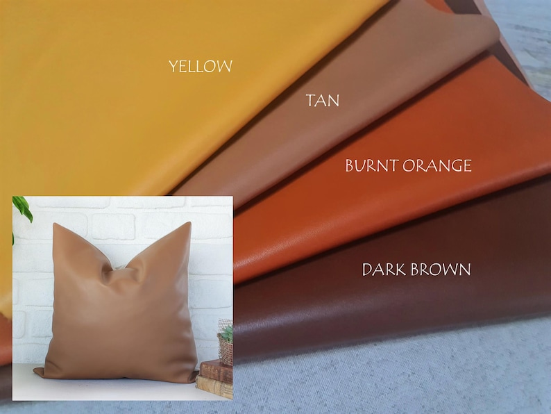 May include: A tan cushion with a smooth surface is shown against a white brick wall. The image also displays swatches of yellow, tan, burnt orange, and dark brown leather, with the colours labelled.