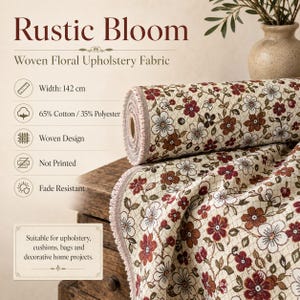 May include: A roll of woven upholstery fabric featuring a floral pattern in shades of red, brown, and white on a cream background. The text reads Rustic Bloom Woven Floral Upholstery Fabric, 142 cm width, 65% Cotton / 35% Polyester, Woven Design.