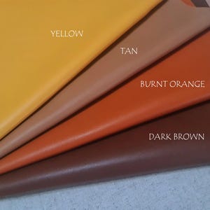 May include: Four fabric swatches in yellow, tan, burnt orange, and dark brown are displayed. The colours are labelled with white text. The material appears to be leather or a leather-like fabric.