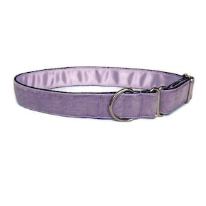 May include: A lavender velvet dog collar with a silver buckle and two silver rings.