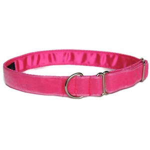 May include: A pink velvet dog collar with a silver buckle.