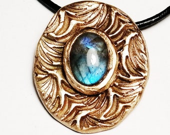 Goldbronze necklace,  art-deco style with a blue labradorite cabochon on a  black leather cord or black leather band+chain