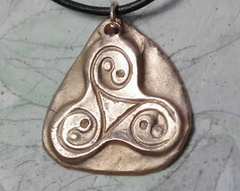 Unisex Pendant silverbronze or goldbronze triskelion, 3 yin-yang & a black leather strap. available in copper. for man or woman