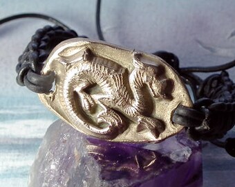 Unisex ajustable bracelet, goldcolor bronze taoist/medieval Dragon + black leathermacrame (copper   possible )