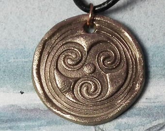 Celtic/Wicca/Viking unisex pendant, triskele hand made in  gold bronze, on a black leather strap, copper  possible too.