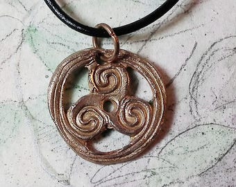 Unisex Pendant : triskele/triskelion/triskell handmade in goldy bronze, black leather strap. in copper  in this shop too