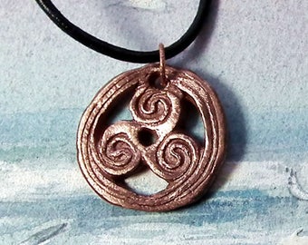 Unisex Pendant, triskele/triskelion/triskell handmade in copper, black leather strap. in gold colour bronze  in this shop too