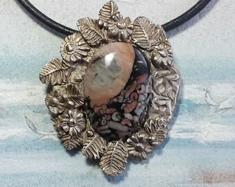 Silverbronze necklace, vegetal-floral /art-nouveau style+ 1 pink and black  crinoid fossile large oval cab on a  black leather cord