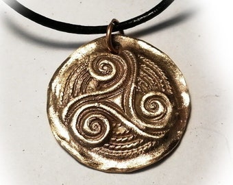 Unisex pendant handmade Goldbronze triskele possible  with 1 stone(5 CZirconia oder 2 corundum ) copper possible too +black leather cord
