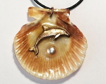 Beach treasure pendant, handmade goldcolor bronze Dolphin, golden freshwater pearl cab on an orange scallop  shell , black leather strap