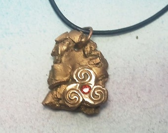 pendant meteorite& 1 celtic Triskelion handmade in goldbronze with an red CZ   black leather cord  Wicca, celtic, Viking unisex jewel