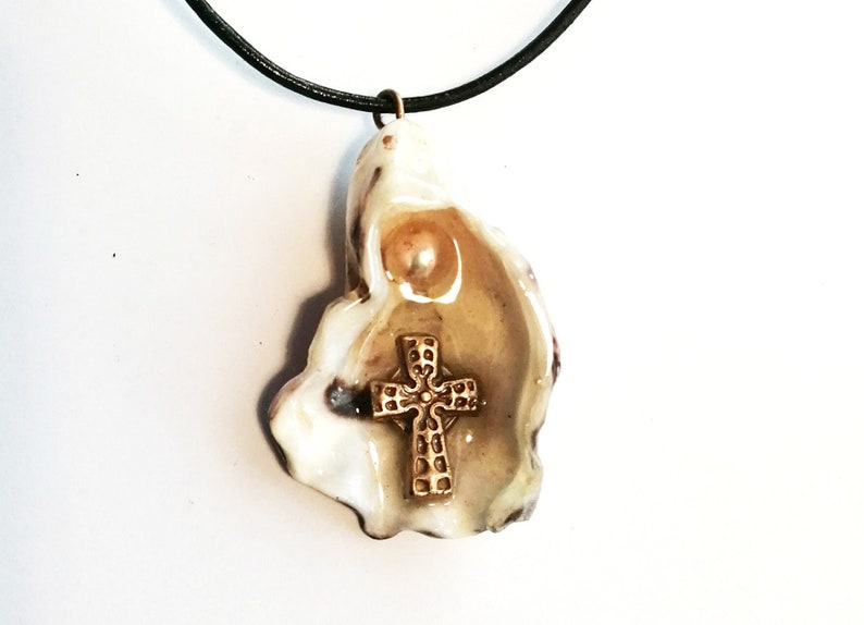 Religious pendant goldbronze cross 1 white freshwater pearl on an oyster shell crystal resin black leather cord beachcombing image 1