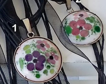 2 romantic enamel  pendants with rose and lilac flowers on a white opale  underground on a silvercolour chain