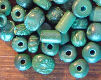 25 Hand-Made Ceramic Beads in Assorted Shapes in Jade Tones.