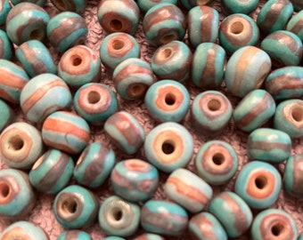 15 Small, Round, Two-Tone Quetzal Beads in 6 Color Combinations.