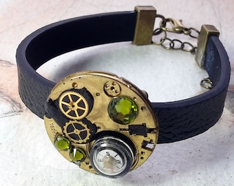 Steampunk/Art-deco, Gustav Klimt Style bracelet, black strap,  brass watch part & cogs , compass,black, resin, green Swarovski crystals