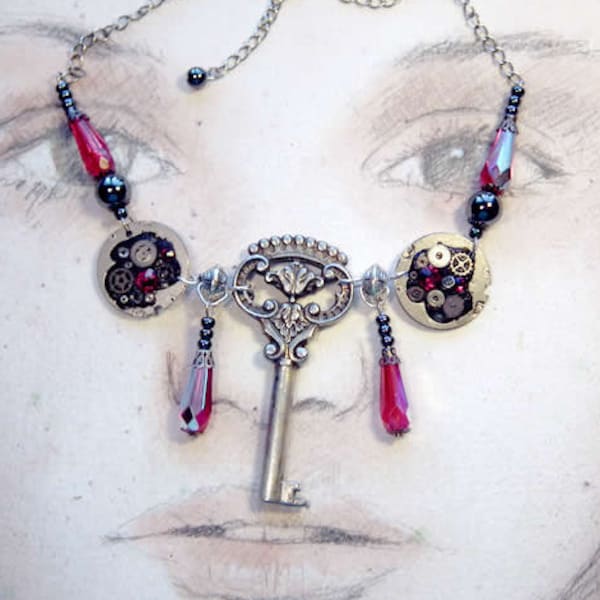 Collier Steampunk hommage à  Gustave Klimt,, clef vintage, perles, gouttes, cabochons plats swarovski rouges+rouages et pièces de montre