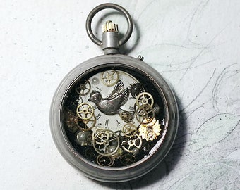 Handmade unisex Steampunk pendant, pocketwatchcase, silver colour dove of peace, dial, cogs, resin , for men and women , leather strap