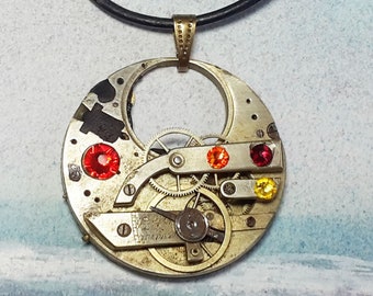 Steampunk  pendant : Gustav Klimt Style, recycled pieces ofpocket  watch Mecanism, gears, black resin, red and orange Swarovski cristal cabs