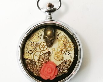 Unisex steampunk/gothic pendant, pocket watchcase, Dial, cogs, skull, coral rose, slighly gold colour resin on a black leather cord