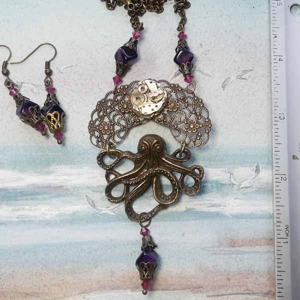 Collier+boucles d'oreilles Steampunk/gothique, filigrane +pieuvre couleur bronze, mecanisme de montre, cabochon+mécanisme et perles vintages