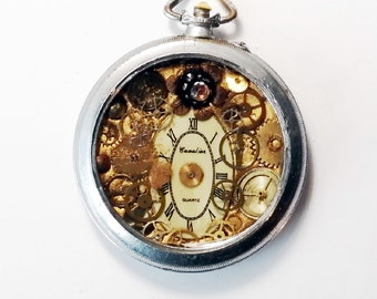 Handmade unisex Steampunk pendant, pocketwatch case dial cogs, slightly goldcoloured resin metal flower,  black leather cord