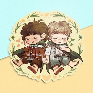 May include: A sticker featuring a cartoon illustration of two characters, one with brown hair and the other with blonde hair, holding hands. They are both wearing green cloaks and are surrounded by yellow flowers and hearts. The text "Art by Sage Windfeather" and "Follow @SageWindfeather on Twitter, Tumblr and Instagram!" is included in the image.