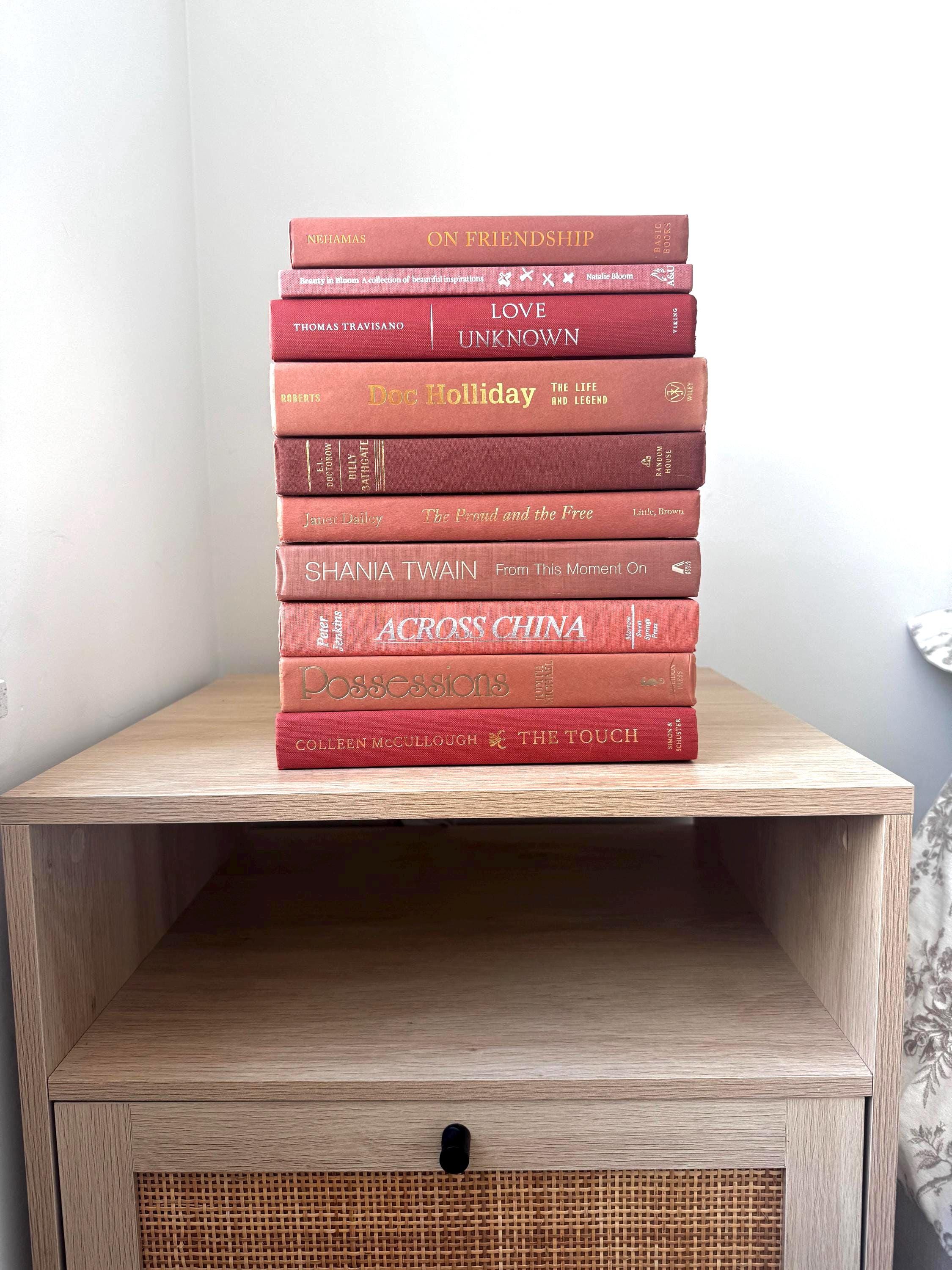 Rosewood Elegance: A Curated Stack of Blush & Berry Hues, pink decorative books, raspberry and rose, soft mauve, dusty rose
