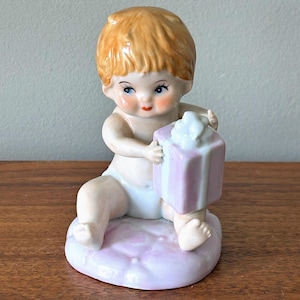 Vintage Baby with a Present Porcelain Figurine by TOMA 5851