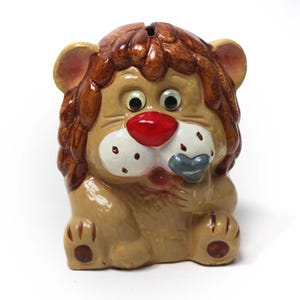 Vintage Lion with a Heart Shaped Bandage Hiding a Cold Sore Bank