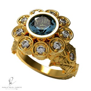 May include: A gold ring with a large blue gemstone surrounded by smaller diamonds. The ring has a floral design with leaves on the band.
