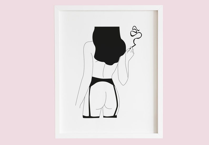 May include: Minimalist black and white art print featuring a line drawing of a figure from the back, wearing lingerie and holding a cigarette. The artwork is framed in a white border, suitable for bedroom or boudoir decor.