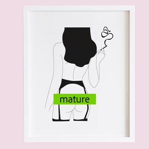 May include: Black and white line art print of a person in lingerie, smoking a cigarette. The word "mature" is in a green rectangle. The art is framed in a white frame.